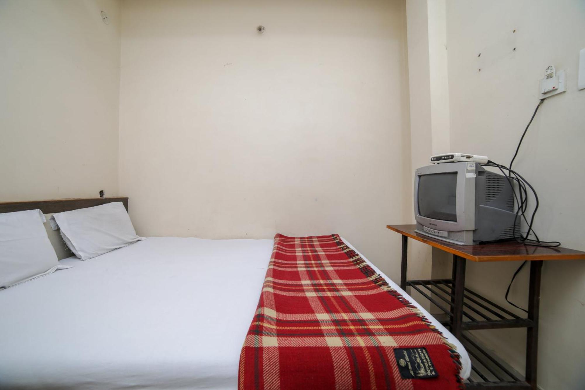 Spot On Shraddha Hotel